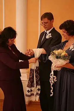 Civil wedding ceremony in Ukraine. The cloth is a ceremonial rushnyk decorated with traditional Ukrainian embroidery.