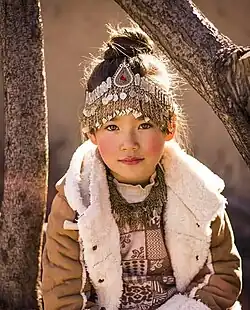 A Hazara girl in traditional Hazara clothing