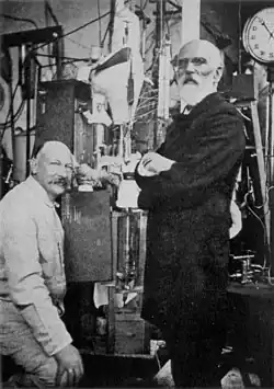 Image 34Heike Kamerlingh Onnes and Johannes van der Waals with the helium liquefactor at Leiden in 1908 (from Condensed matter physics)