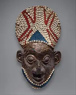Royal mask; by artists of the Bamum people (Cameroon); before 1880; wood, copper, glass beads, raffia and shells; height: 66&nbsp;cm; Metropolitan Museum of Art[107]