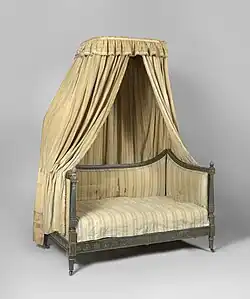 Crown supported by poles at the back to make a self-contained piece of furniture. Bolsters apparently missing.