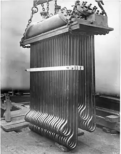 Superheater of a Lancashire boiler 1900, for the extraction of heat from waste gasses, and transfer of heat to saturated steam passing from the boiler to the steam range or engine. This raised the overall thermal efficiency of the plant, and would also prevent damage from slugs of condensate by ensuring the saturated steam was dry and not wet.[120]