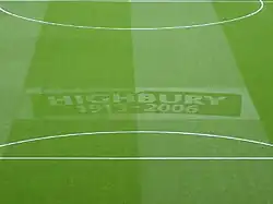 A football pitch with "Highbury 1913–2006" emblazoned on the grass: Arsenal played home matches at Highbury between those years.