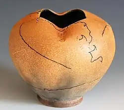 Pot with an example of horsehair raku technique. The vessel was taken out of the kiln at 732 Celsius and horsehair applied on, which burned into it.