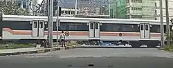 An 8300 class coach at Dela Rosa crossing