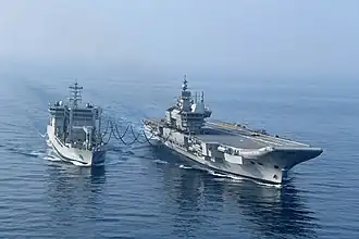 Vikrant undertaking a replenishment at sea with INS Deepak