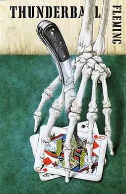 Book cover showing a knife sticking through a skeleton's hand, pinning playing cards to the table. The words on the cover are "Thunderball" and "Fleming"
