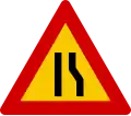 Road narrows on right hand side