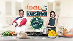 An image of Boy Logro and Chynna Ortaleza in a kitchen. The show title is displayed on the upper center of the image. The text "lutong bahay" is displayed on the center, below the show title.