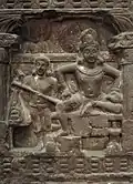 1B: Sibi Jataka. King Sibi gives some of his own flesh to the wounded.