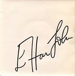 white (fading?) sleeve with Elton John's signature