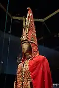An ornate, tall Saka bashliq -golden man