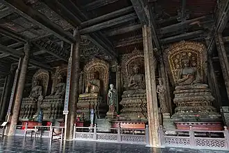 Jin Dynasty (1115–1234) statues of the Five Tathāgatas in the Mahavira Hall. From left to right: Amoghasiddhi, Amitābha, Vairocana, Ratnasambhava, Akshobhya