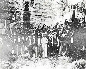 Historical photo of Cuban exiles with José Martí