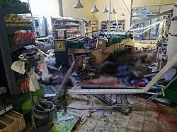 Shelled shop in Kherson, 3 May 2023