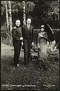 King Haakon VII, Crown Prince Olav and Queen Maud in the estate gardens, 1924