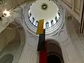 The dome from the inside and the Lithuanian flag split into three separate one-colour flags