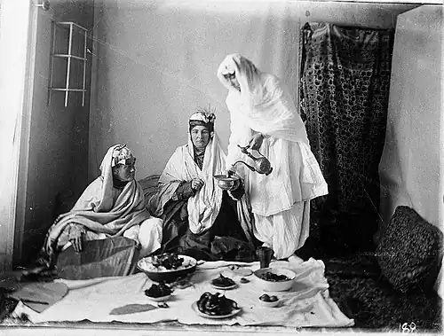 Ladies of the royal harem wearing firaq partug, 19th century
