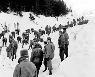 View of a group of people during a rescue operation after the avalanche in Biały Jar