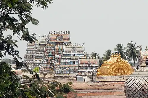 A row of gopurams (towers) in the Srirangam Ranganathaswmy temple, a typical South Indian Vaishnavate temple complex in Srirangam, Tamil Nadu