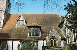The south side of the nave. Note the higgledy-piggledy appearance of the dormer windows and gables