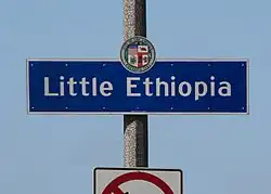 Little Ethiopia neighborhood sign located at the intersection of Fairfax Avenue and Olympic Boulevard