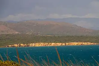 Reddish-colored limestone cliffs.