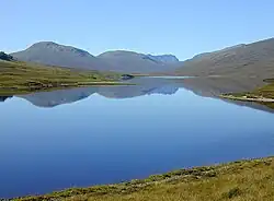 Loch a' Bhraoin With Slioch poking out behind Beinn Bheag in the distance.