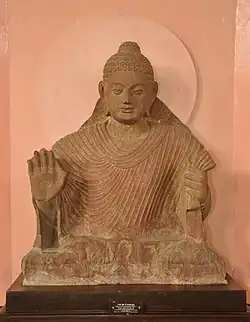 Buddha in Abhaya Mudra. Kushana-Gupta transitional period. Circa 3rd-4th century, Mathura.[46]