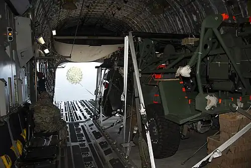 An M1301 ISV being airdropped out of a C-17