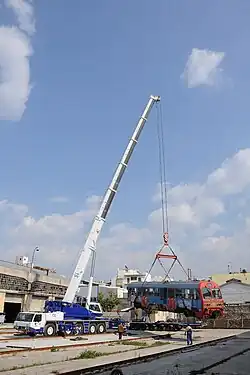 Tadano-Faun ATF all-terrain crane unloads MAN railcar 6525 at the now-abandoned Piraeus Engine Sheds at Lefka, March 2011.