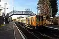 A Merseyrail Class 507 waits at the Ormskirk-bound platform.