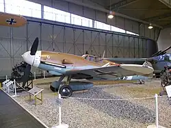 a colour photograph of an aircraft in a museum