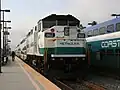 A Metrolink train (center) and a Coaster train (right) at Oceanside station