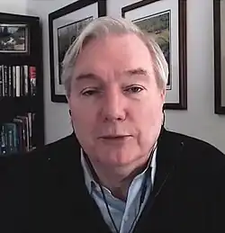 Image of Osterholm, with books and picture frames in the background