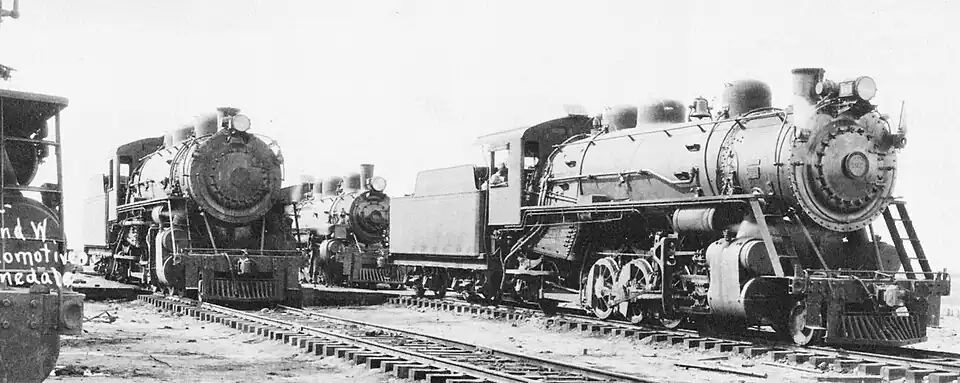The Minarets and Western Locomotives 102 and 103 stand in front of 101 in Pinedale.