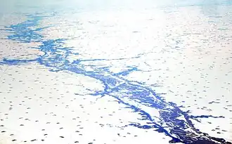 The Minnesota River Valley and tributaries as seen from the air at Redwood Falls, Minnesota. The river occupies only a small portion of the wide valley carved by the Glacial River Warren.