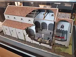 Model of spital that preceded the Grammar School. Arches support the nave, giving access to the now-demolished side buildings. Only the left-hand end of the nave survives.