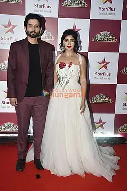 Mudit Nayar and Yukti Kapoor in a long, white dress