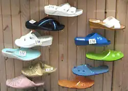 Various styles of mules in a shop window