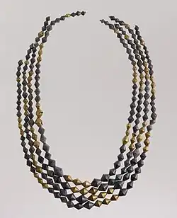 Sumerian necklace beads; 2600–2500 BC; gold and lapis lazuli; length: 54&nbsp;cm (21&nbsp;in); Metropolitan Museum of Art (New York City)