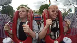 Niki and Sammy Albon at the bottom of the Orlando Slingshot reverse bungee ride, clutching the handles on the seats, in May 2017
