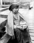 A Nuu-chah-nulth woman selling baskets in Nootka Sound in the 1930s