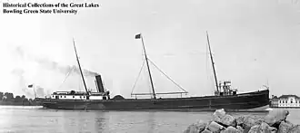 Photograph of Northern Wave docked, with another ship in view