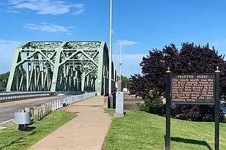 Information sign by the bridge entrance describing the Trenton Ferry and George Washington's reception at Trenton on April 21, 1789.
