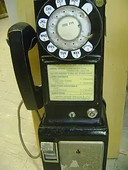 Typical 3-slot payphone (Western Electric 233G) commonly in use in the US until the late 1960s.