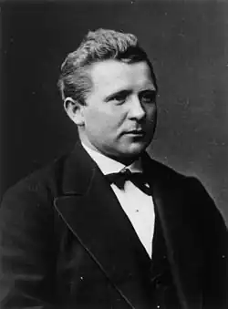 picture of a man in a suit and bow tie