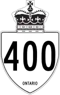 Typical Ontario primary/400-series highway sign using a bullet-shaped shield