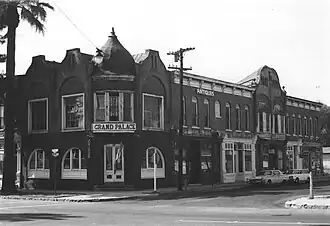 Photograph of the Ontario State Bank Block, a two-story, brick commercial building with an ornate roofline