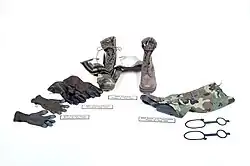 Handwear and footwear items, consisting of: combat gloves, NBC gloves, brown combat boots, and NBC gaiters with slippage keepers